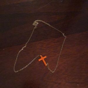 Sideways orange cross necklace